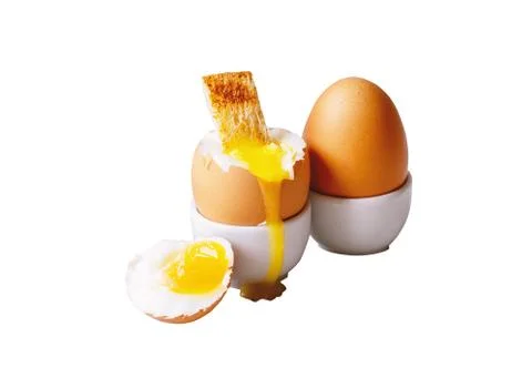 Soft-boiled egg in eggcup isolated on white. Stock Photos