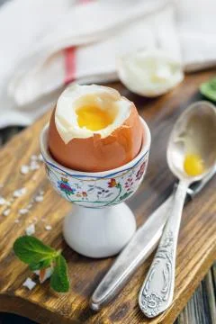 Soft-boiled egg on the stand for breakfast. Stock Photos