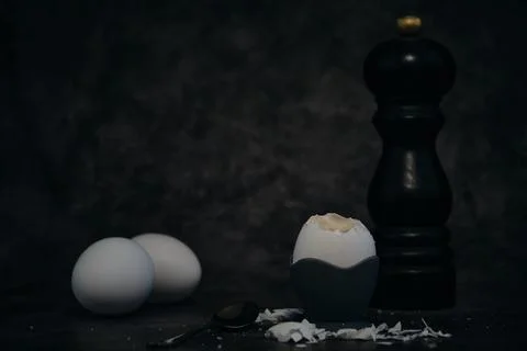 Soft-boiled egg on a stand on a dark background Stock-Fotos