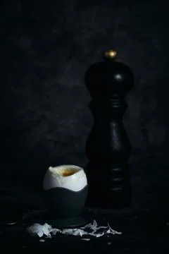 Soft-boiled egg on a stand on a dark background 스톡 사진