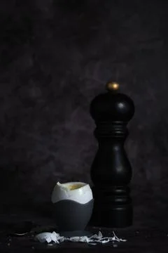 Soft-boiled egg on a stand on a dark background 스톡 사진