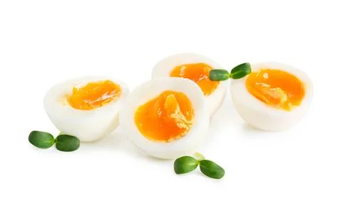 Soft boiled eggs and micro green on white background Stock Photos