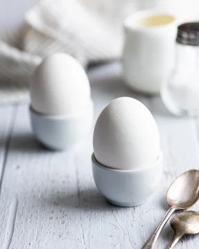 Soft-boiled eggs, breakfast on a white background Stock Photos