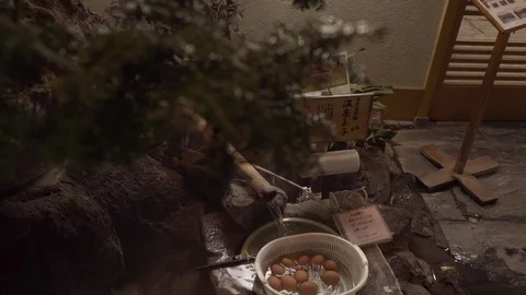 Soft boiled eggs cooked at hot spring water Stock Footage 79440870