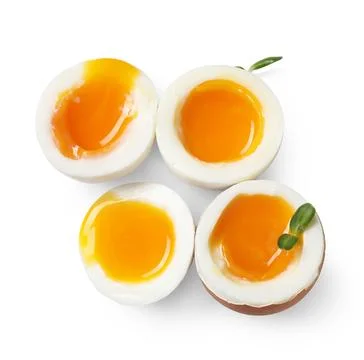 Soft boiled eggs with micro green on white background Stock Photos