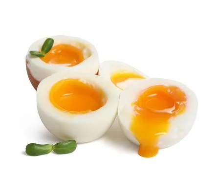 Soft boiled eggs with micro green on white background Stock Photos