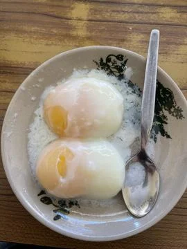 Soft-Boiled Eggs In Patterned Porcelain Plate With Stainless Steel Spoon Stock Photos