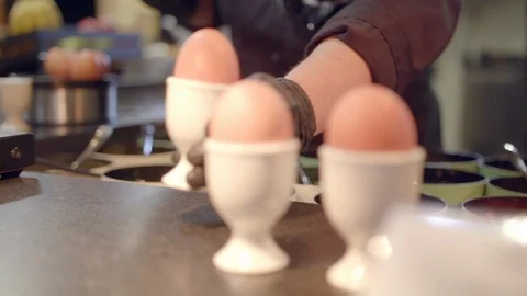 Soft-boiled eggs served in restaurant Stock-Footage 99577268