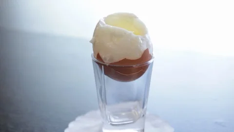 Soft-boiled egg.soft egg.lightly boiled egg.the camera moves around this to the Stock Footage 114695351