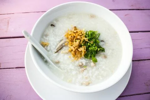 Soft-boiled rice with fish and pork Stock Photos