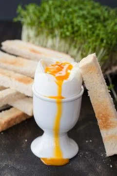 Soft boiled runny egg Stock Photos