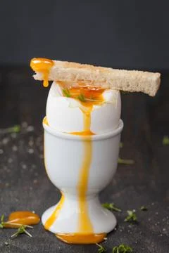 Soft boiled runny egg Stock Photos
