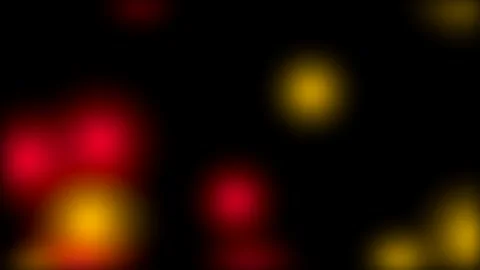 Soft Bokeh Blurs: Abstract Red and Yellow Luminous Orbs on Black 库存影片 339178014