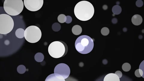 Soft bokeh circles float gently against a dark background with subtle purpl.. Stock Footage 344289024