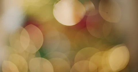 Soft bokeh light bubbles floating in warm blur. Abstract golden defocused backgr Stock Footage 340450337