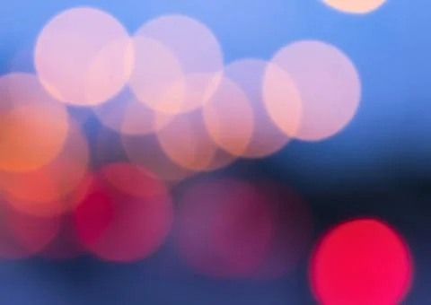 Soft bokeh lights abstract background with pink and red hues Stock Photos