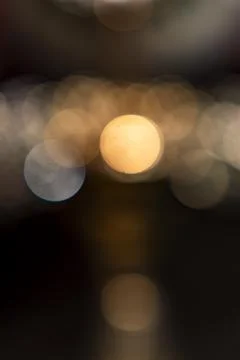 Soft bokeh lights create a dreamy atmosphere in an evening setting Stock Photos