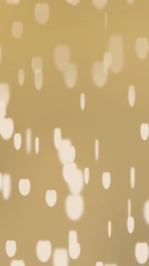 Soft bokeh lights on warm beige background. 2d animation 動画素材 345712126