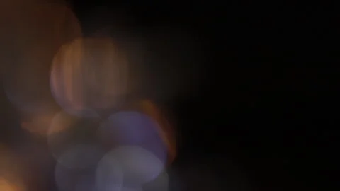 Soft bokeh shimmering with blue and gold lights on the left Video stock 309340475