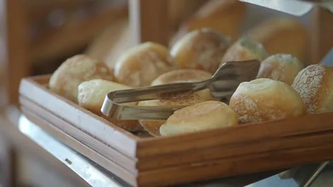 Soft bread rolls on display at a bakery shelf Stock Footage 340179110
