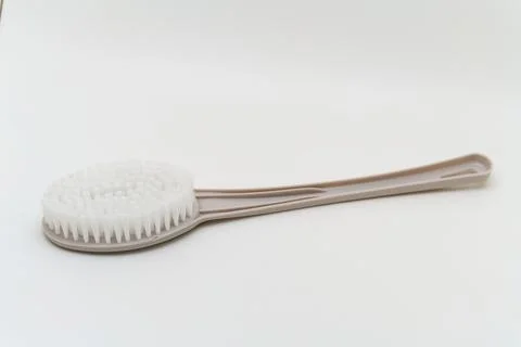 Soft brush with long handle for cleaning or grooming tasks Photos