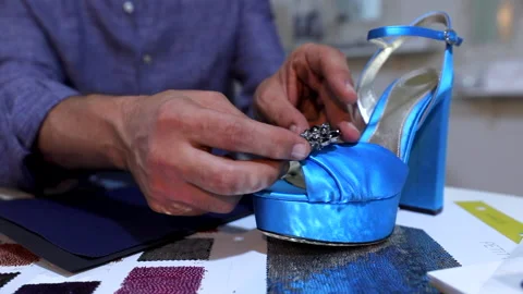 Soft camera movement shoe designer working on high heels for the production . Stock Footage 146165153