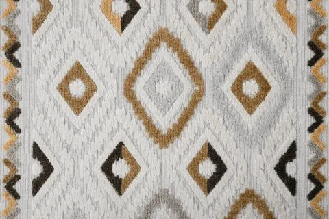 Soft carpet with beautiful pattern as background, top view Stock Photos