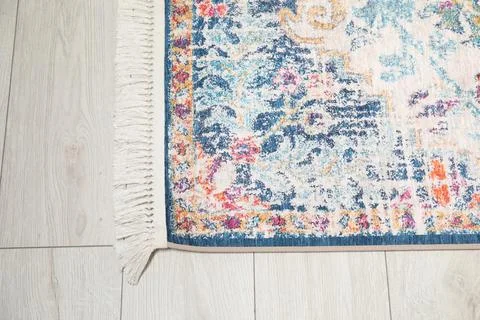 Soft carpet with pattern on white laminated floor indoors, top view Stock Photos