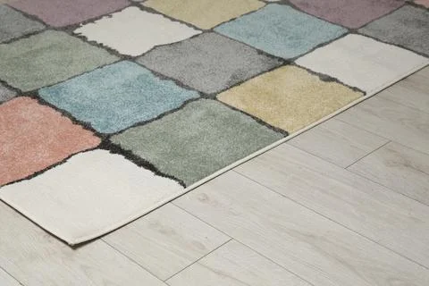 Soft carpet with pattern on white laminated floor indoors, space for text Stock Photos