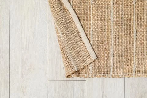 Soft carpet with pattern on white laminated floor indoors, top view. Space .. Stock Photos