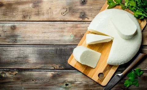 Soft cheese with a branch of mint. Stock Photos