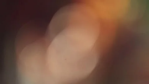 Soft Circular Bokeh Abstract Background with Warm Cinematic Light Stock Footage 325476712