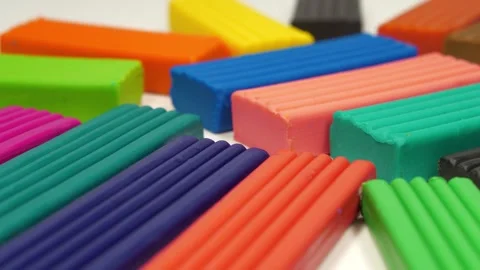Soft clay blocks for fun and skillful modeling. Bright plasticine Stock Footage 331750439