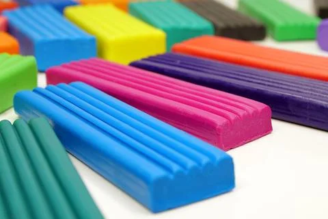 Soft clay blocks for fun and skillful modeling. Colorful plasticine pieces .. Stockfoto's