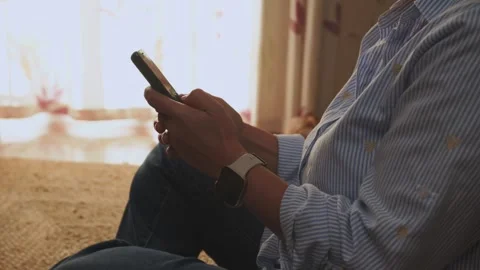 Soft Click Of Smartphone Button As Person Texts On Phone In Cozy Home Setup Stock Footage 320064623