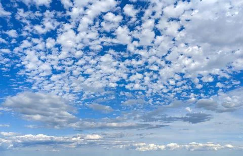 Soft cloud background under blue sky. Bright cloud background with cumulus Stock Photos
