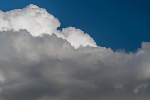 Soft cloud edge against clear blue gradient, minimalist composition with ai.. Stock Photos
