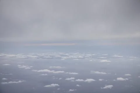 Soft Cloud Layers Floating Above Calm Ocean Stock Photos
