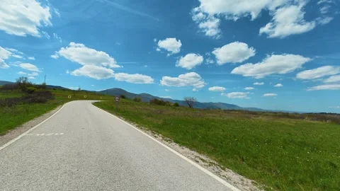 Soft clouds drift above open fields. Balkan, Eastern Europe, POV Video stock 333586924