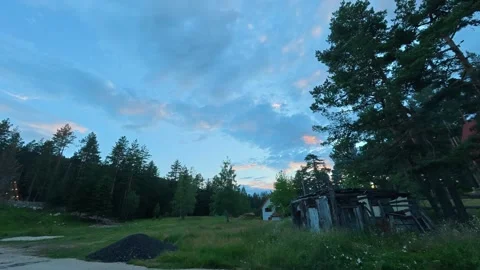 Soft clouds drift above tall pine trees. Durmitor, Timelapse Stock-Footage 342980900