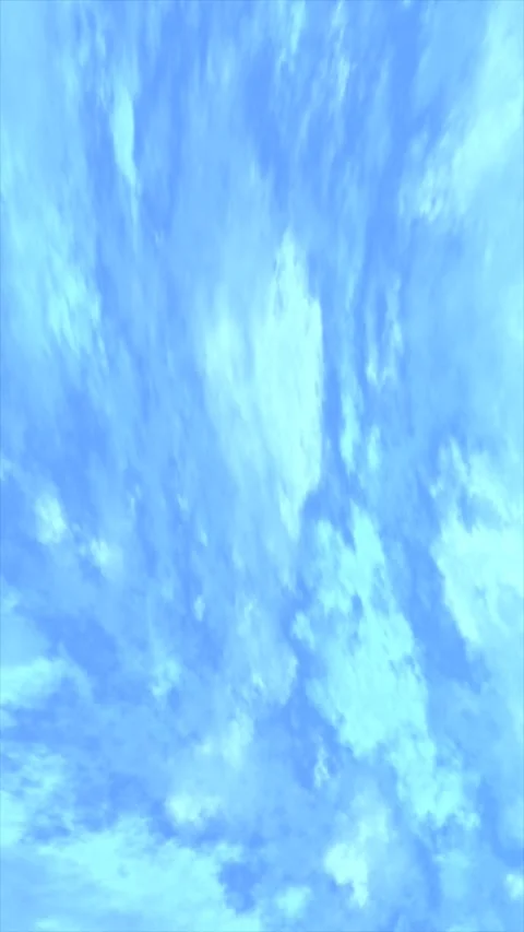 Soft clouds drift across a bright blue sky Stock Footage 311804668