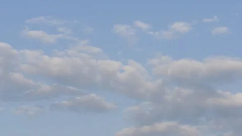 Soft Clouds Floating in a Calm Blue Sky Stock Footage 340035635