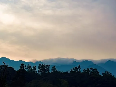 Soft clouds formations float over the Iguaque mountain, in the eastern Andean Stock Photos