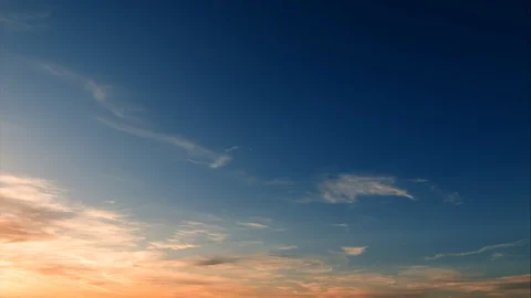 Soft clouds at a golden sunset - Real time Stock Footage 100747461