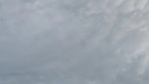 Soft Clouds Over a Calm Sky Stock Photos