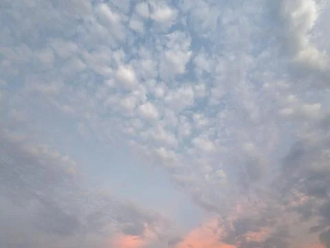 Soft Clouds in a Sunset Sky Stock Photos