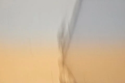 Soft colored gradient with motion blur and vertical lines suggesting movement Foto stock