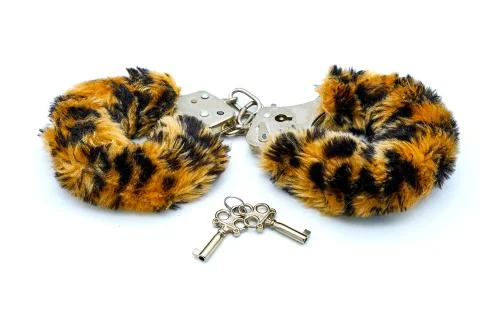 Soft cuffs with color under leopard for sexual games. Toy for making love in  Stock Photos