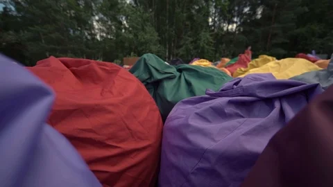 Soft cushion chairs lie on the lake 스톡 동영상 123712808