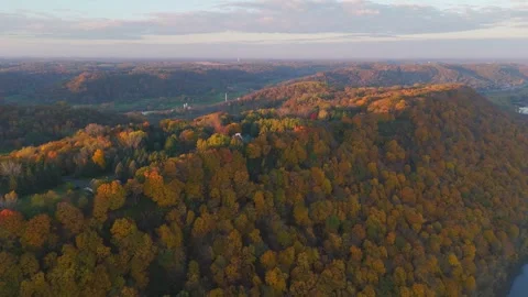 Soft dawn glow settles over calm wetlands and a slow river at sunrise. Video stock 324899964
